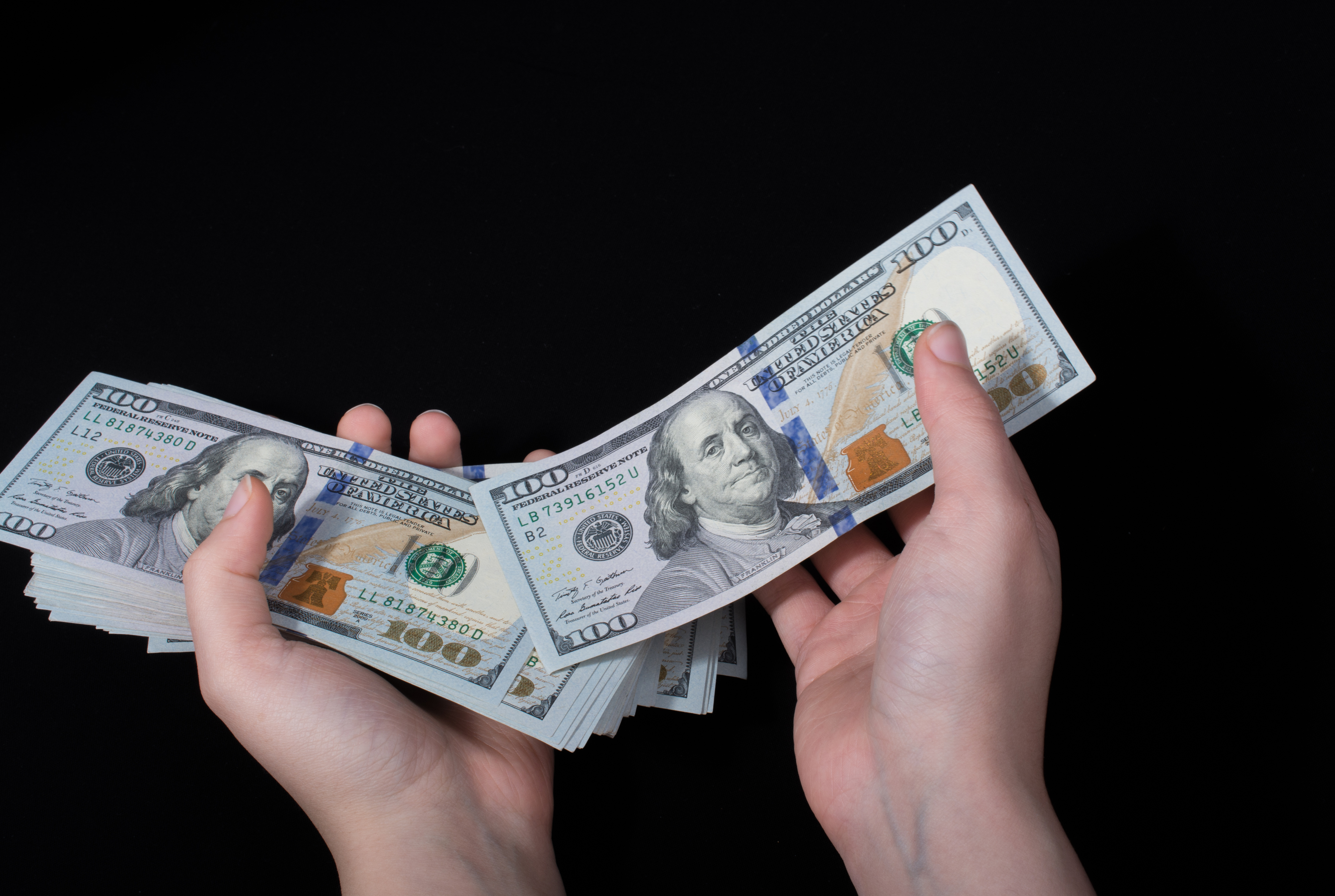 Hand Holding American Dollar  Isolated on White Background